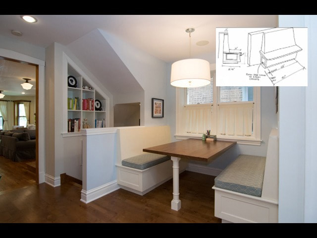 Built-in breakfast nook with white cabinetry, wood table, and bench seating in modern kitchen